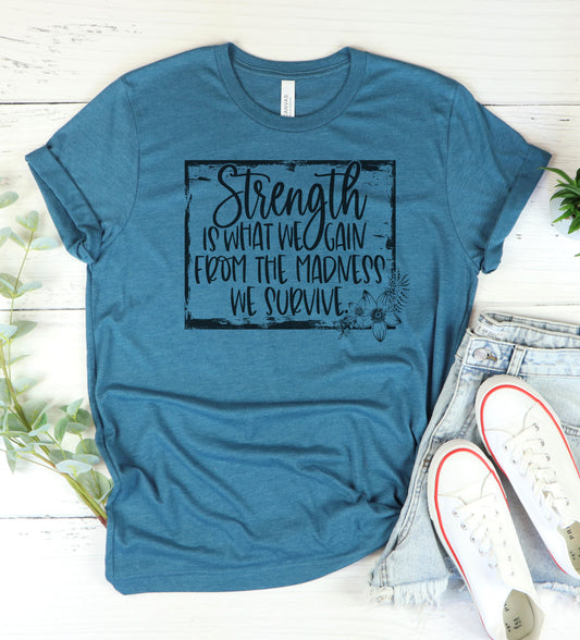 Strength Is What We Gain Graphic Tee